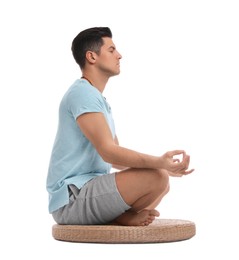 Photo of Man meditating on white background. Zen concept