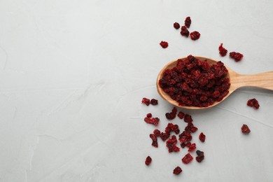 Dried red currant berries on light table, flat lay. Space for text