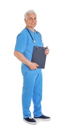Photo of Full length portrait of male doctor in scrubs with clipboard isolated on white. Medical staff