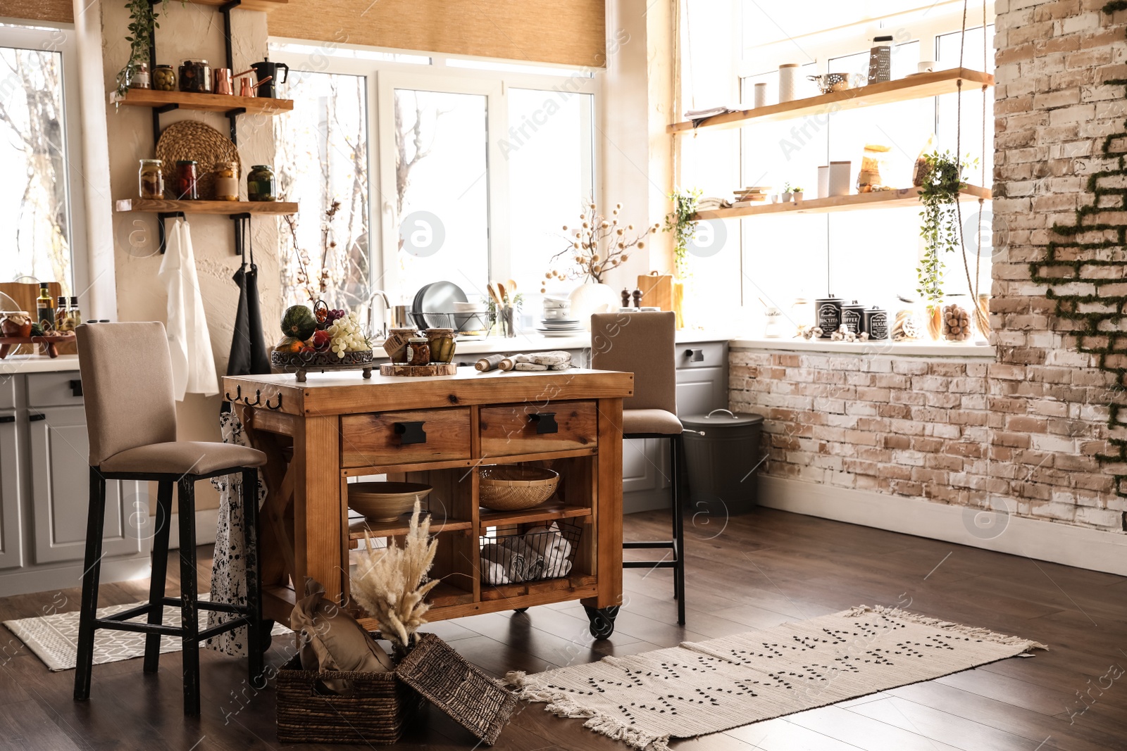 Photo of Stylish kitchen interior with wooden table and chairs