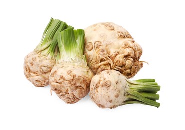 Photo of Many raw celery roots isolated on white