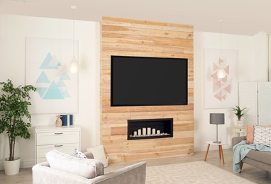 Photo of Living room interior with modern TV on wooden wall