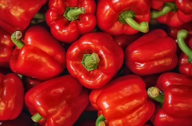 Photo of Pile of paprika peppers as background, closeup