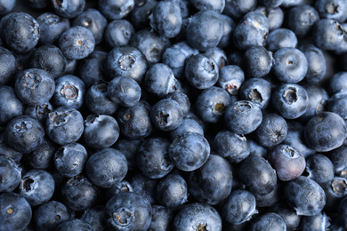 Photo of Fresh tasty blueberries as background, closeup view