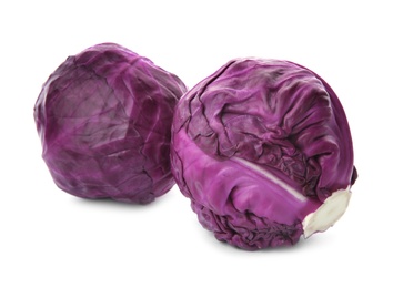Photo of Whole ripe red cabbages on white background
