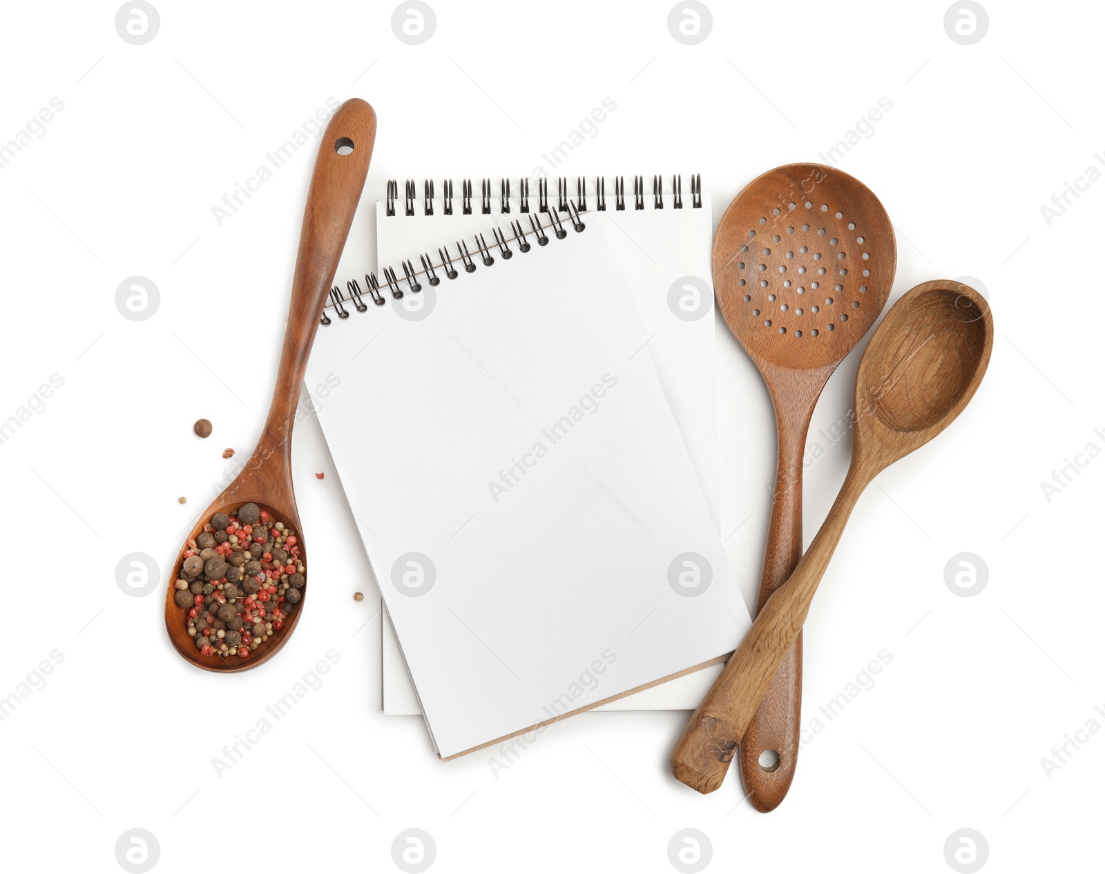 Photo of Blank recipe books, spices and wooden utensils on white background. Space for text