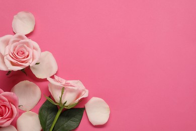 Photo of Beautiful roses and petals on pink background, top view. Space for text