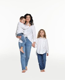 Photo of Little children with their mother on white background