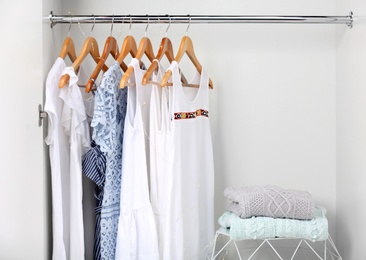 Photo of Women clothing on hangers in wardrobe