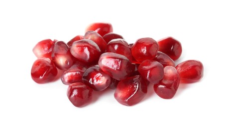Photo of Pile of tasty pomegranate grains isolated on white