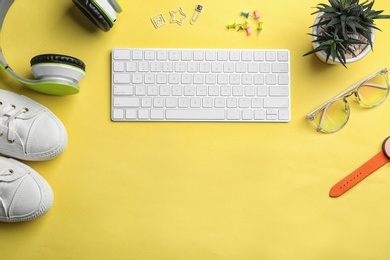 Photo of Flat lay composition with keyboard, blogger's stuff and space for text on color background