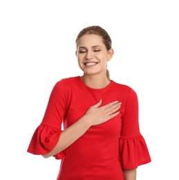 Photo of Portrait of young woman holding hand near heart on white background