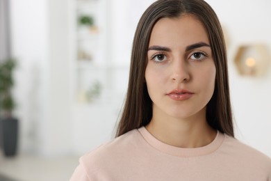 Photo of Portrait of beautiful woman indoors, space for text