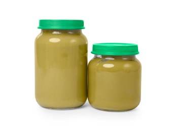 Photo of Glass jars with healthy baby food isolated on white