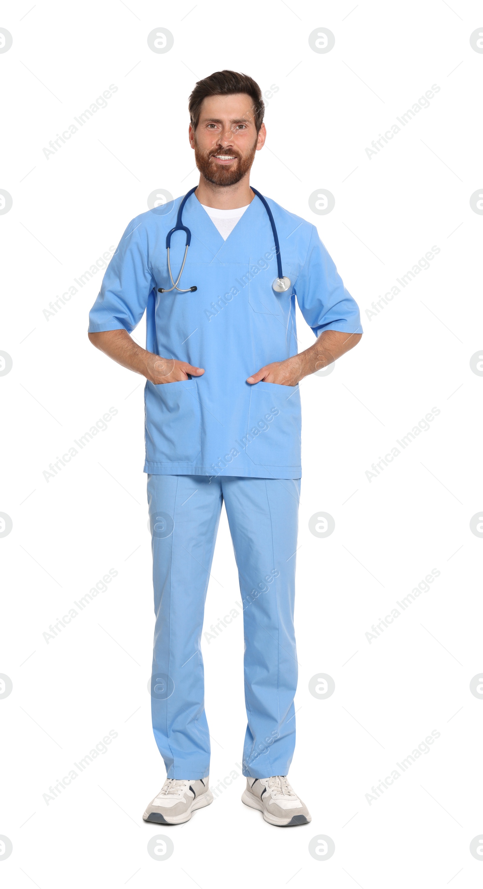 Photo of Full length portrait of doctor in scrubs on white background