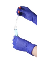 Photo of Scientist dripping liquid from pipette into test tube on white background, closeup