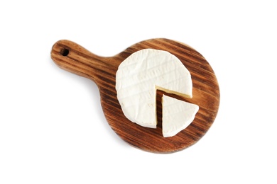 Wooden board with brie cheese on white background, top view