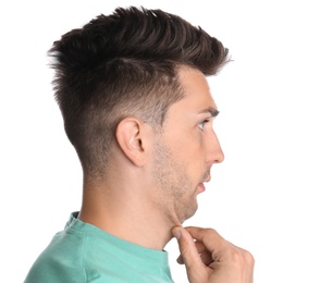 Young man with double chin on white background