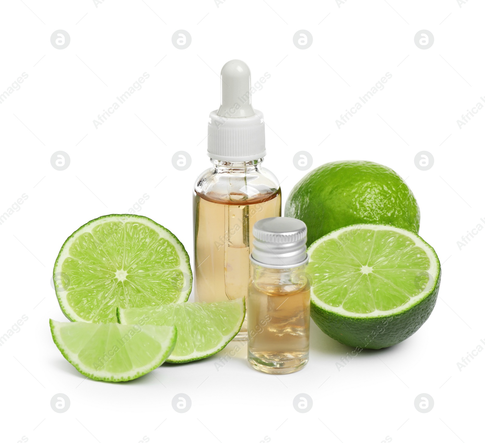 Photo of Lime essential oil in bottles and citrus fruits isolated on white