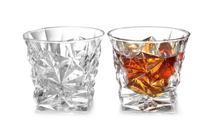 Photo of Empty and full whiskey glasses on white background