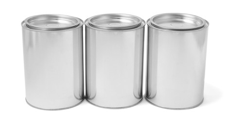 Photo of Many cans of paints on white background