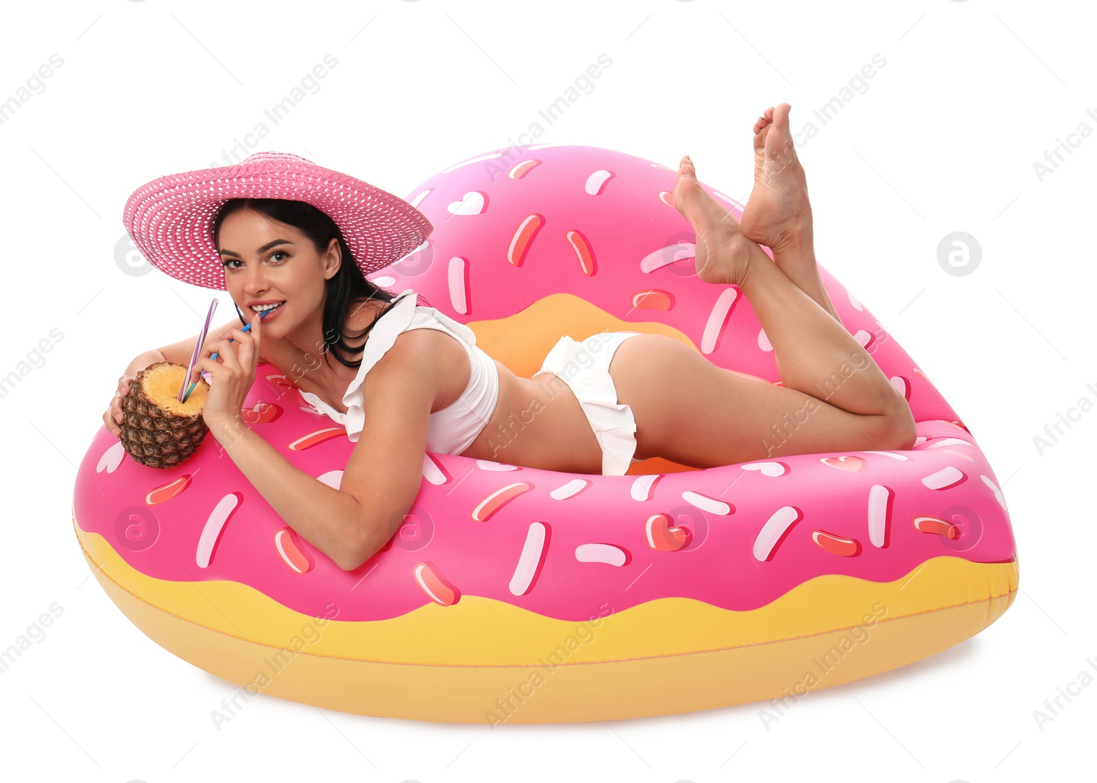 Photo of Beautiful young woman in stylish bikini with cocktail and inflatable ring on white background