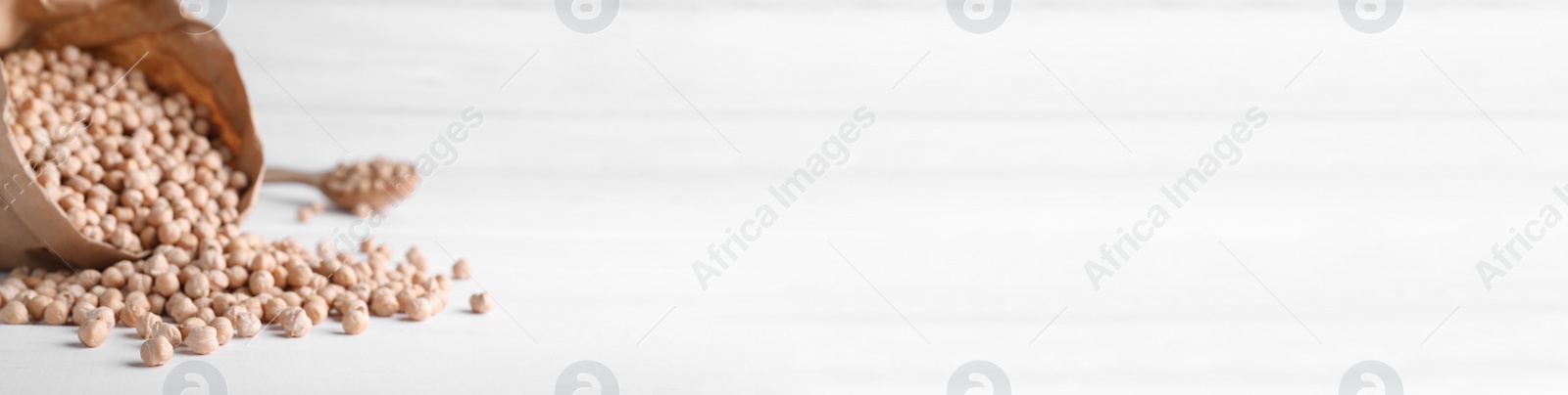 Photo of Chickpeas on white table, space for text