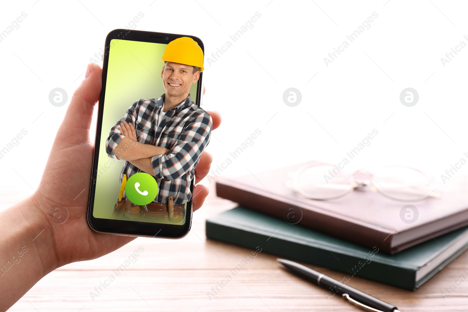 Image of Woman with smartphone calling professional repairman indoors, closeup