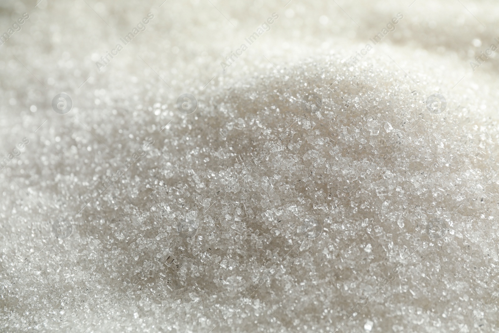 Photo of Pile of granulated sugar as background, closeup