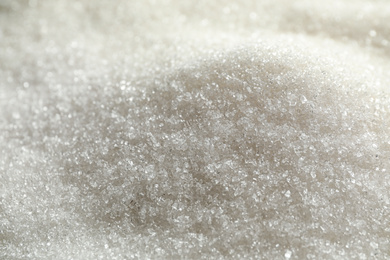 Pile of granulated sugar as background, closeup