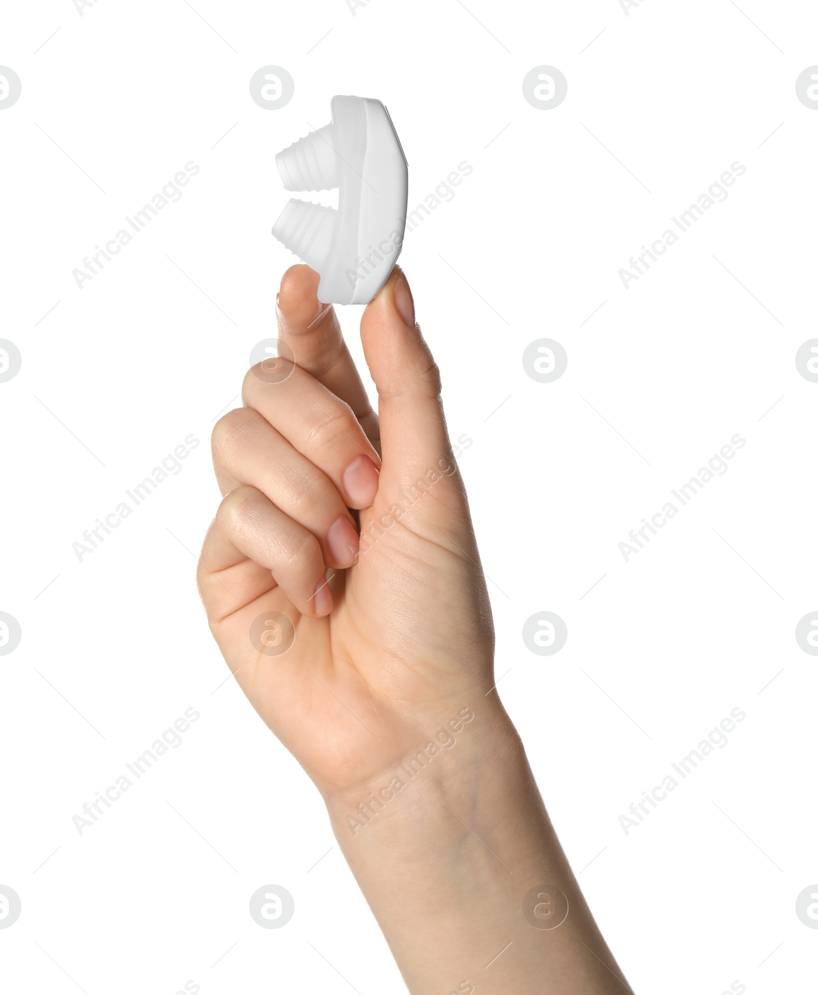 Photo of Woman holding anti-snoring device for nose on white background, closeup