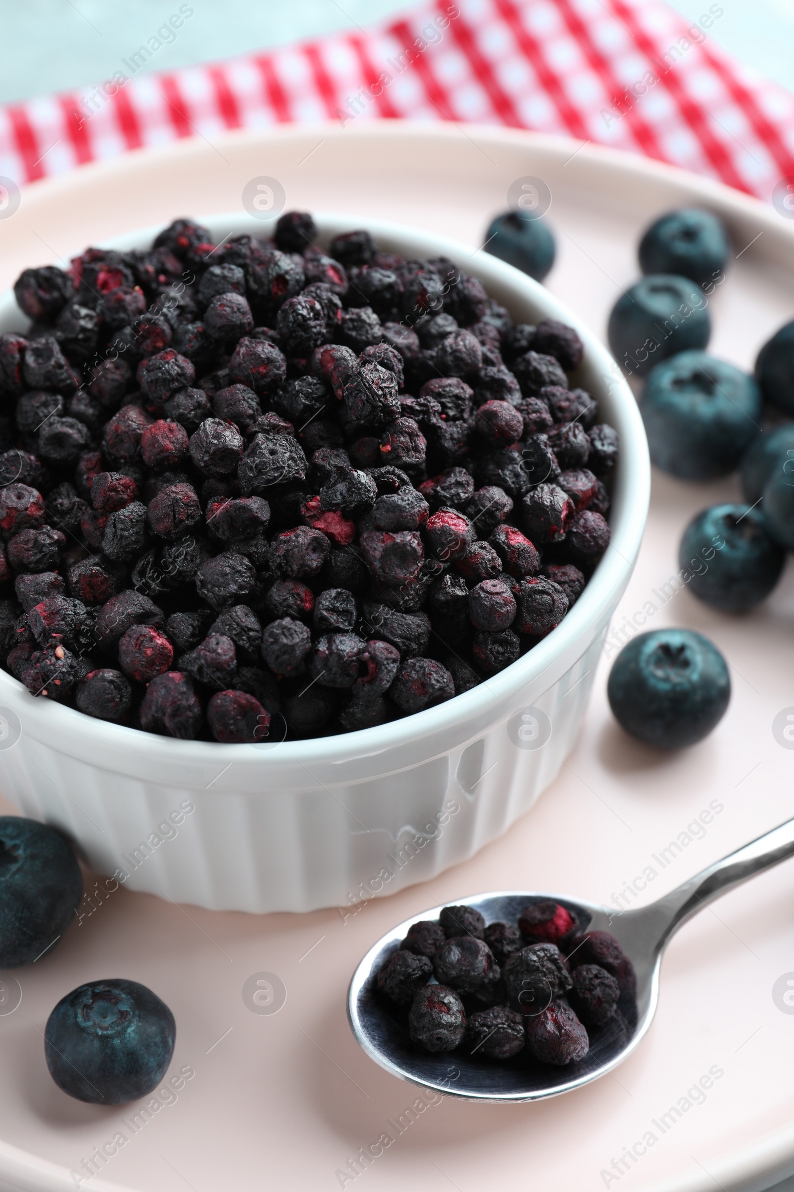 Photo of Freeze dried and fresh blueberries on table, closeup