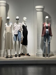 Photo of WARSAW, POLAND - JULY 17, 2022: Mango store display with women clothes in shopping mall