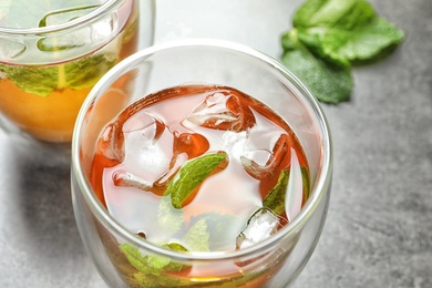 Photo of Glass with aromatic mint tea, closeup