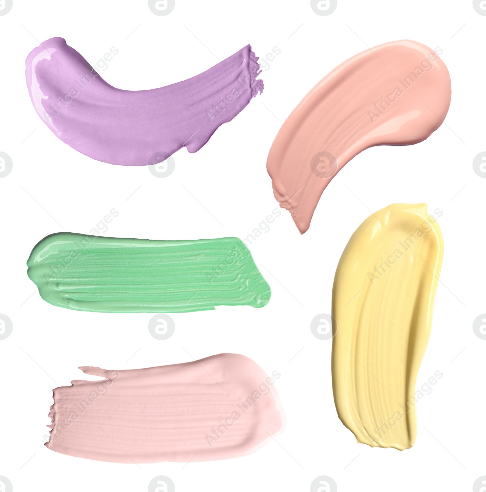 Image of Set with strokes of color correcting concealers on white background, top view