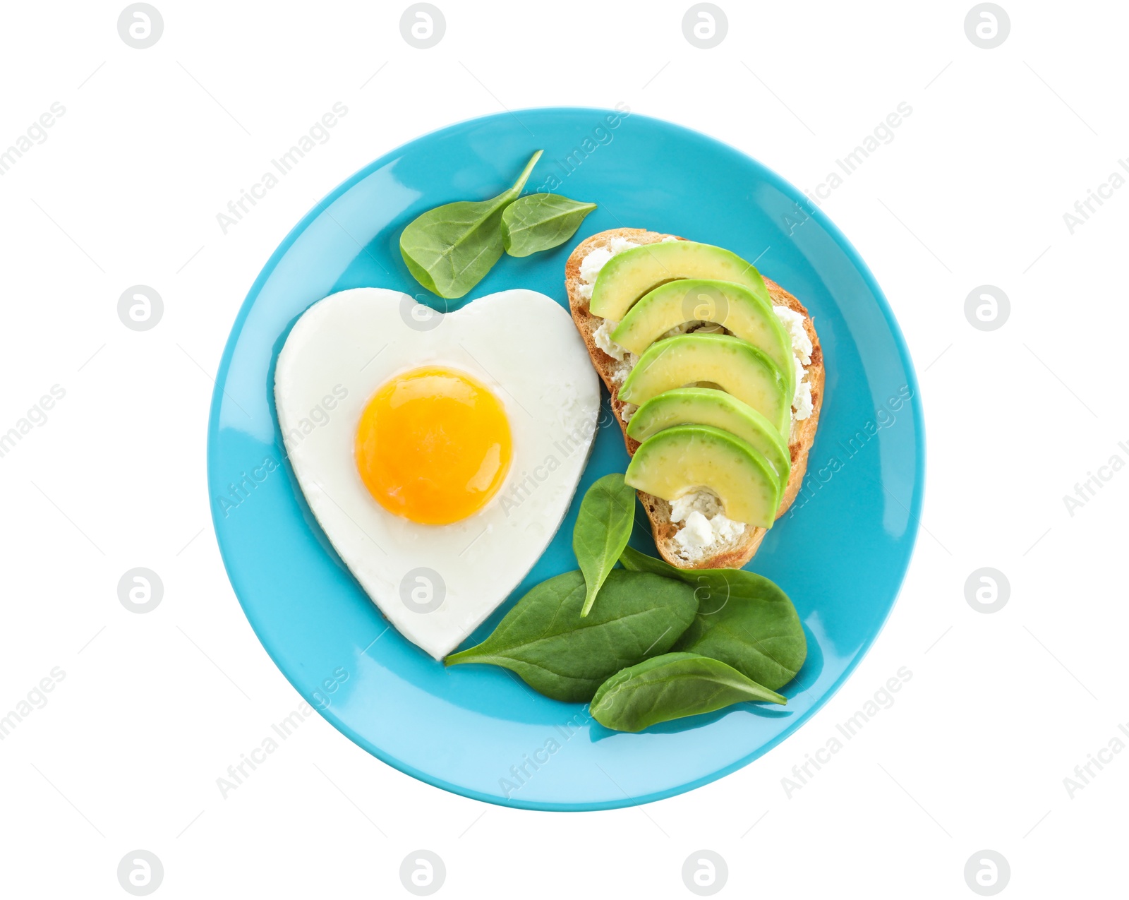 Photo of Plate of tasty breakfast with heart shaped fried egg isolated on white, top view