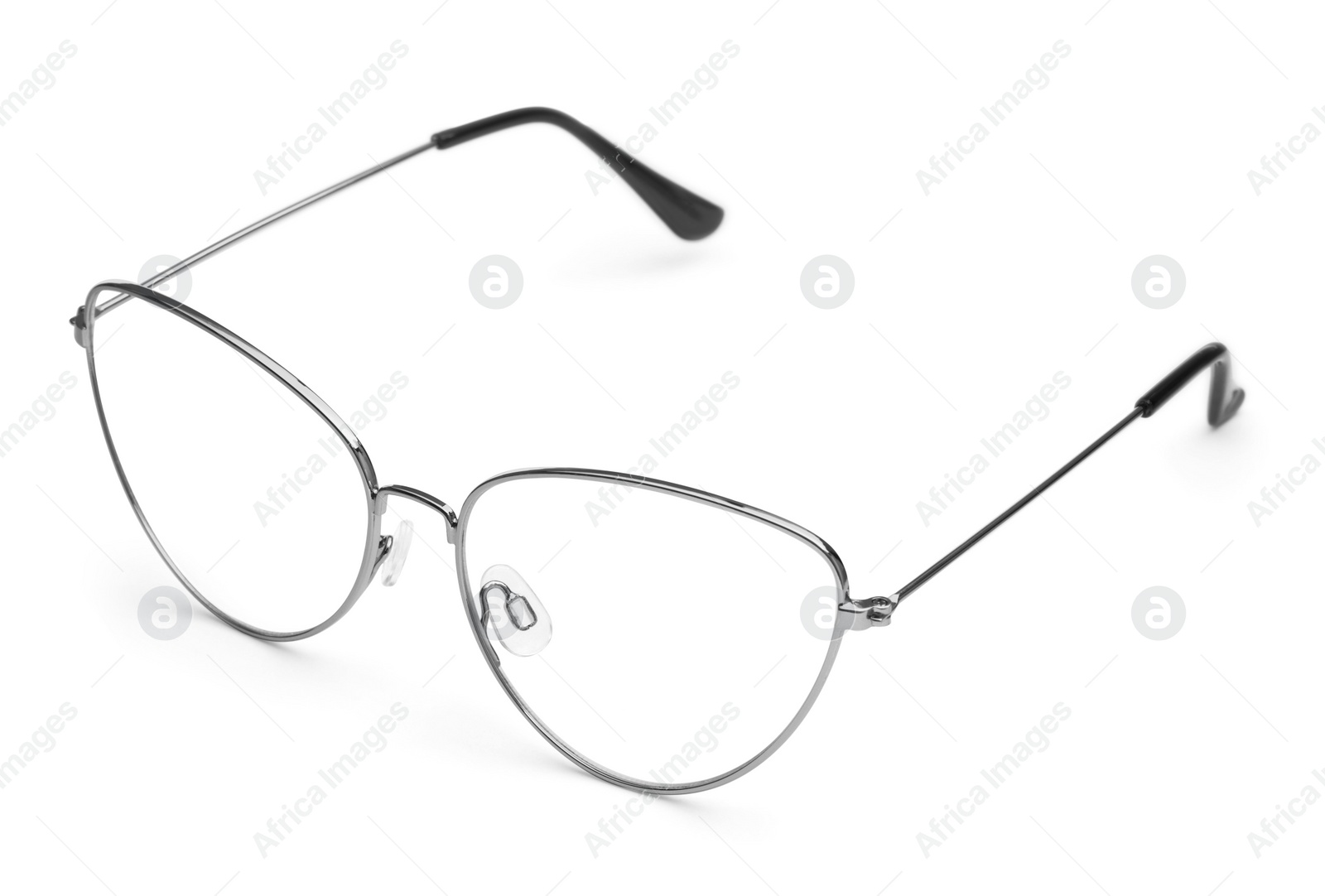 Photo of Stylish glasses with metal frame isolated on white