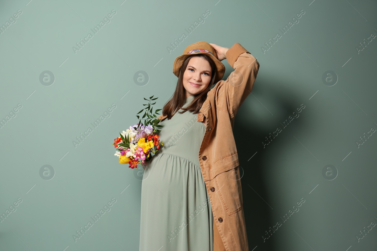 Photo of Beautiful pregnant woman on color background