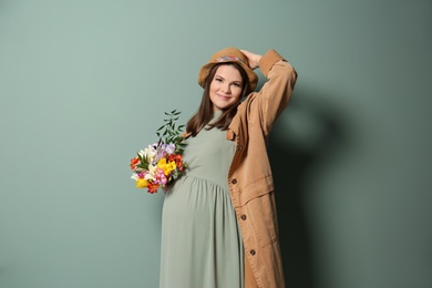 Photo of Beautiful pregnant woman on color background