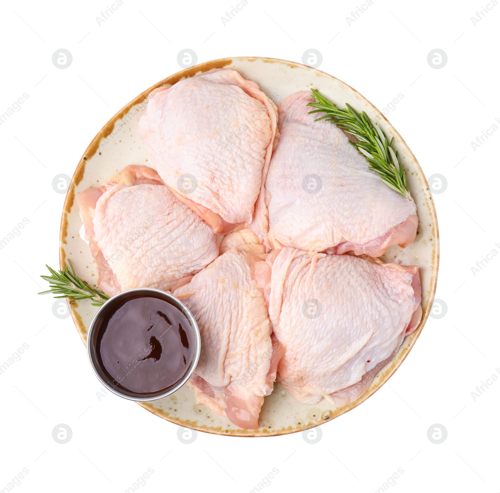 Photo of Plate with marinade, raw chicken and rosemary isolated on white, top view