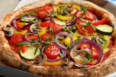 Delicious vegetable pizza in cardboard box, closeup view