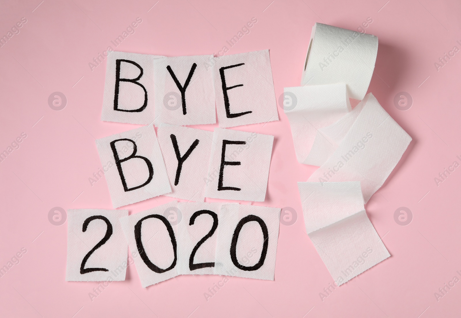 Photo of Toilet paper with text Bye Bye 2020 on pink background, flat lay