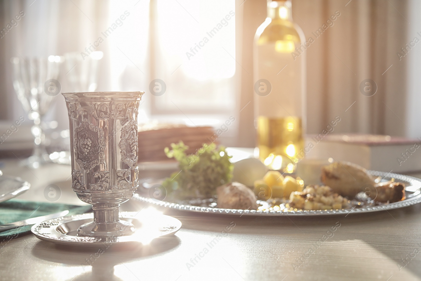 Photo of Table served for Passover (Pesach) Seder indoors. Space for text