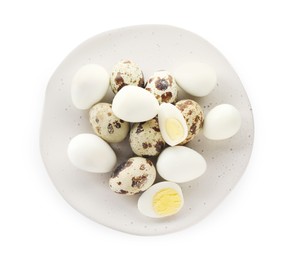 Photo of Unpeeled and peeled hard boiled quail eggs in plate on white background, top view
