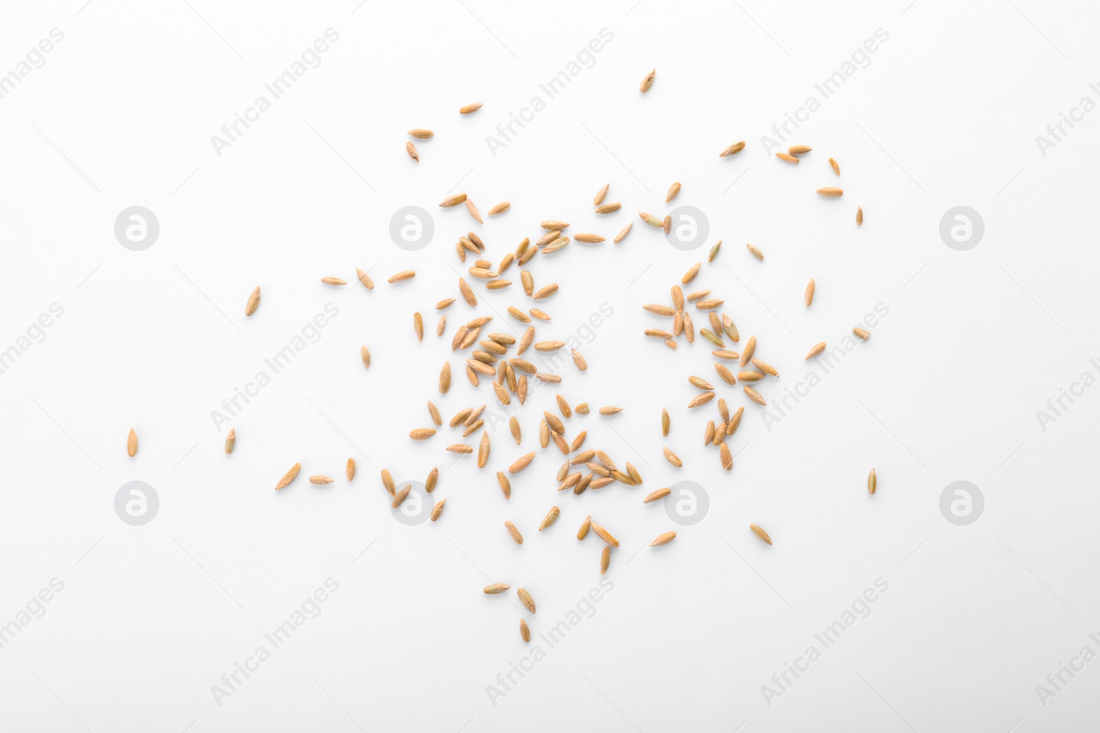 Photo of Raw rye on white background. Healthy grains and cereals