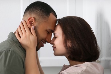 Dating agency. Lovely couple spending time together indoors