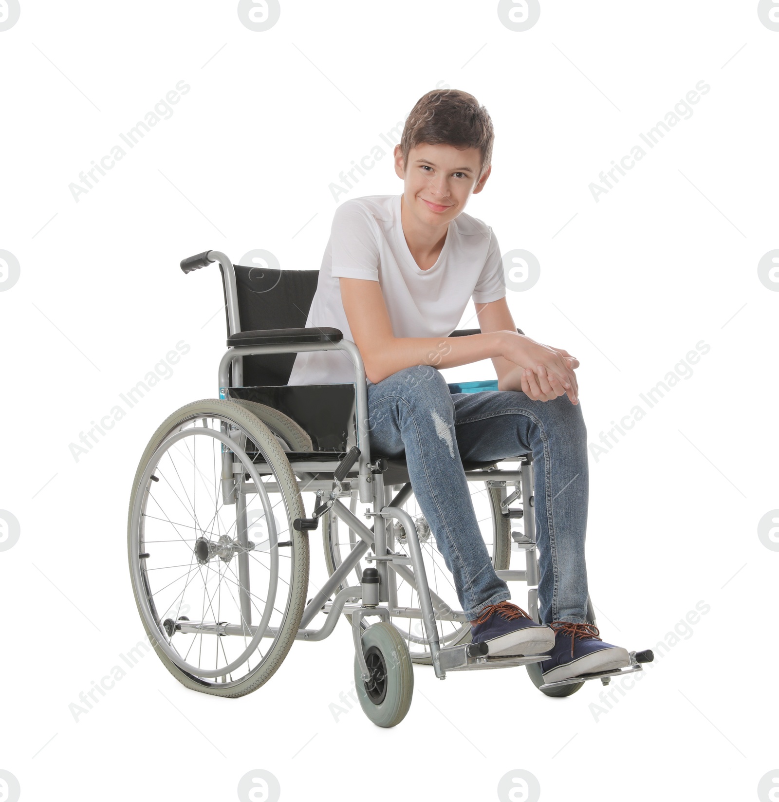 Photo of Teen boy in wheelchair on white background