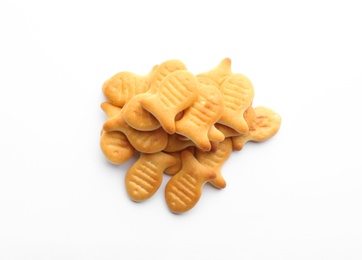 Delicious crispy goldfish crackers on white background, top view