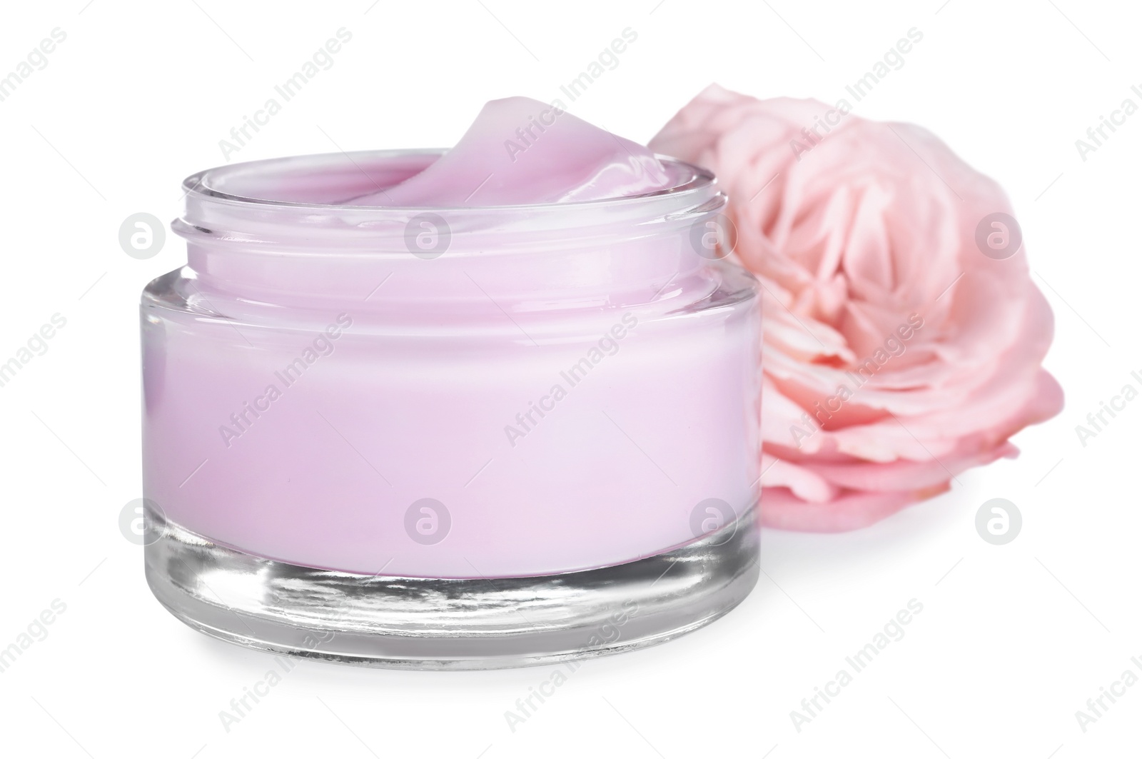 Photo of Jar of organic cream and flower isolated on white
