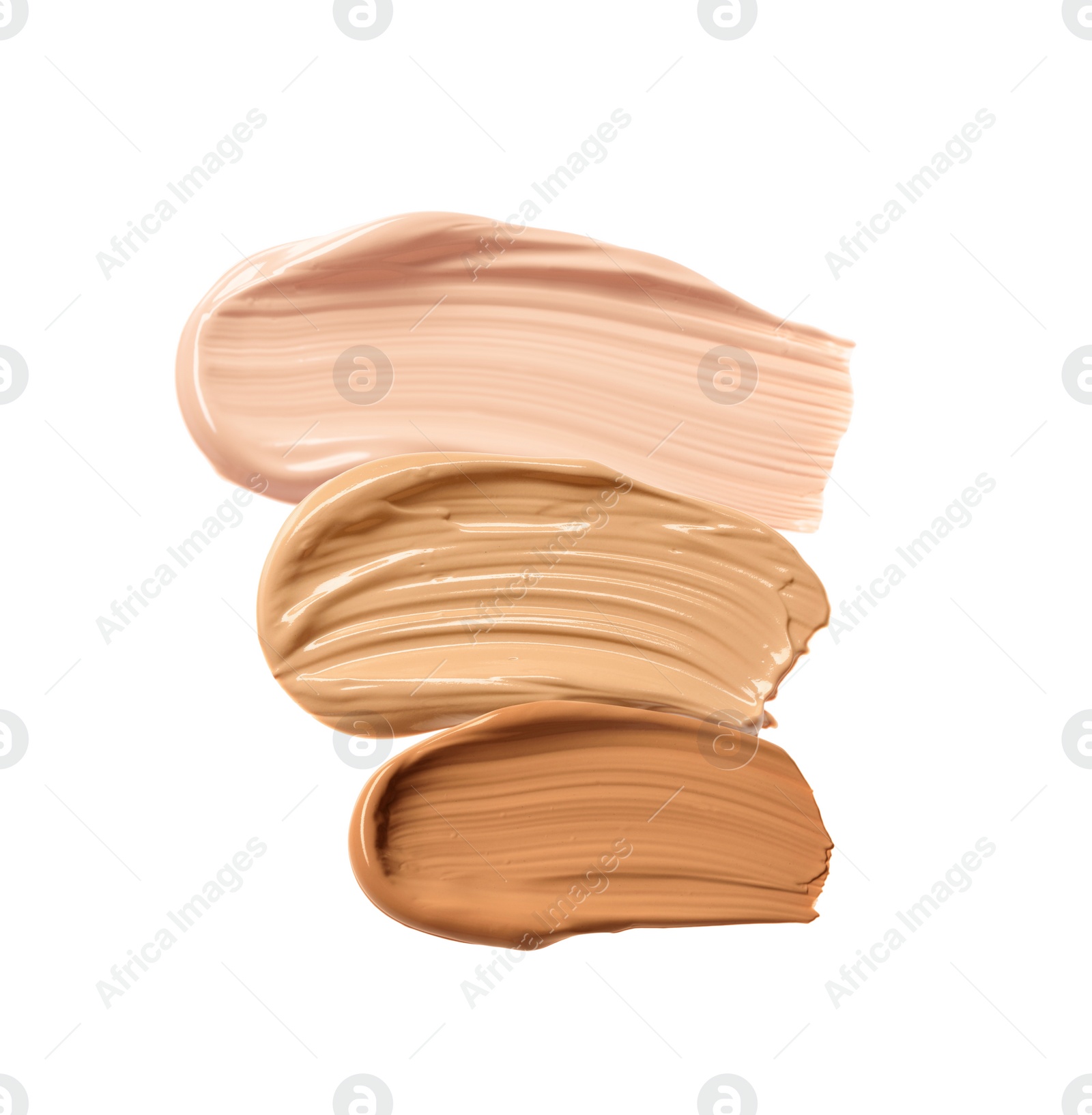 Image of Different shades of liquid skin foundation on white background, top view